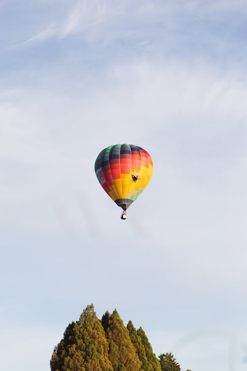 A Hot Air Balloon Flying over Trees