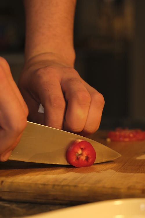 Hands Cutting Vegetable