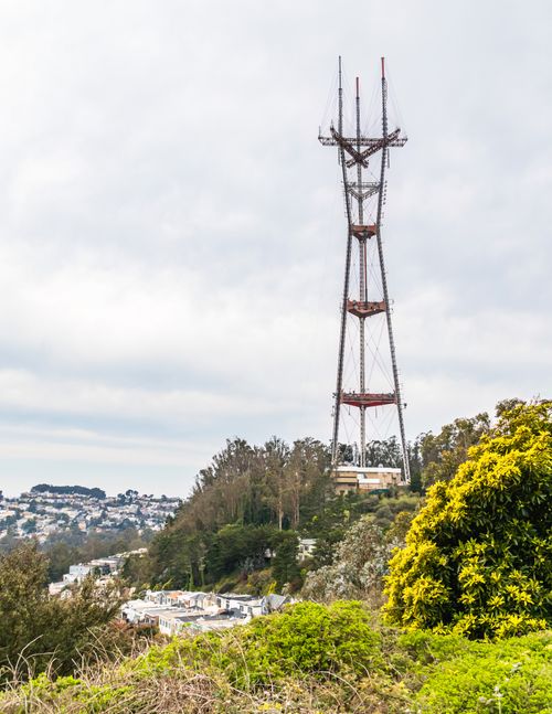 Free Sutro Tower rising above the lush landscape of San Francisco, captured on a summer day. Stock Photo