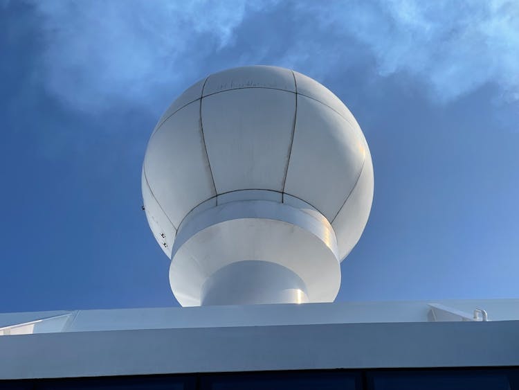 Cloud Over Balloon-shaped Installation On Roof