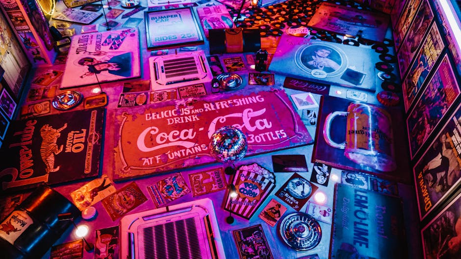 Red Coca-cola Signage Surrounded by Other Signages