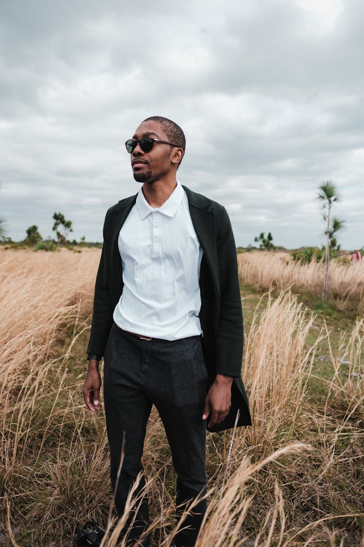 Photo Of A Man In A White Shirt And Black Coat