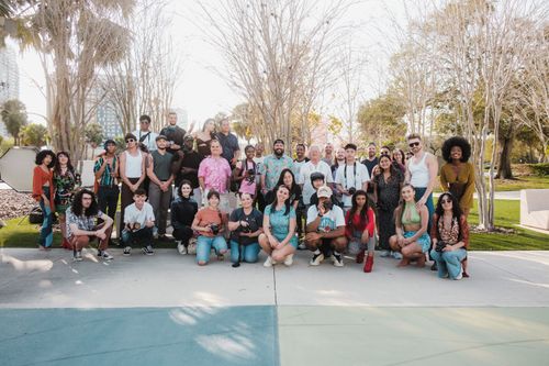 The whole studio gathered outdoors under the trees — photo by Airam Dato-on on Pexels