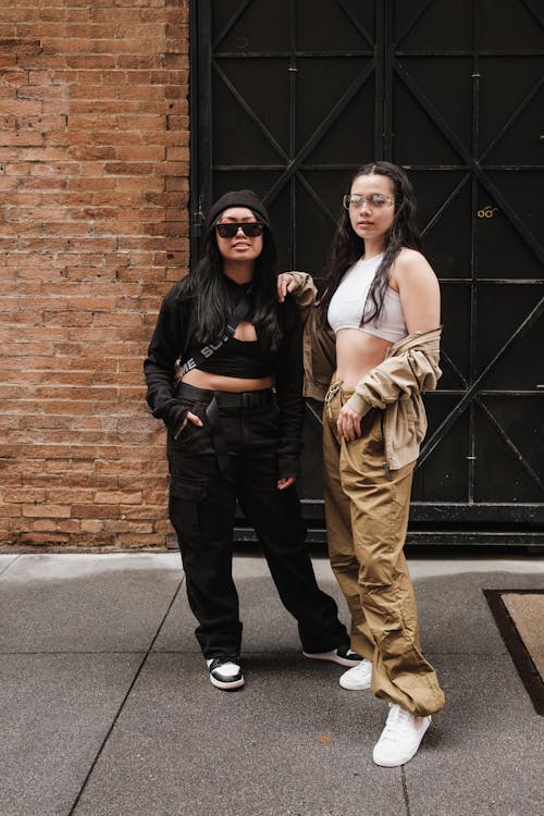 Stylish Women in Streetwear Posing on Street