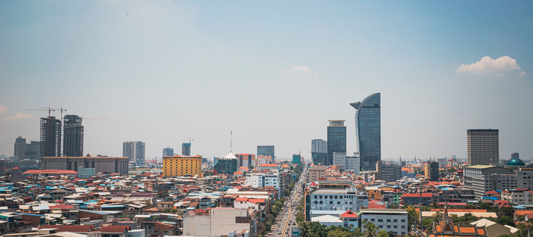 Discover the modern skyline and bustling streets of Phnom Penh from an aerial perspective.