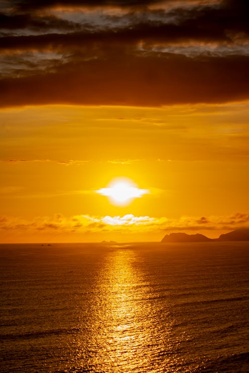 Sun on Yellow Sky at Sunset over Sea Coast