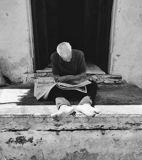 Free stock photo of asian old man, black and white, newspaper