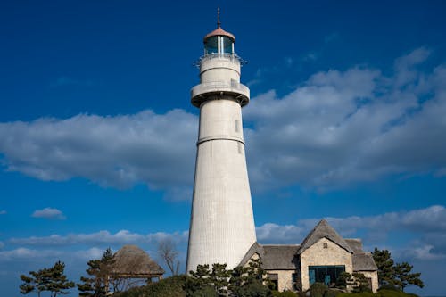 Free Cloud on Blue Sky over Lighthouse Stock Photo
