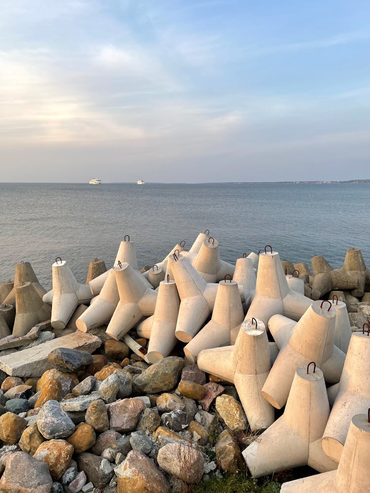 View Of A Pile Of Stones And Breakwater On The Shore O The Baltic Sea 