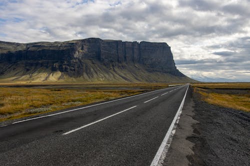 View of a Cliff from an Asphalt Road in Iceland 