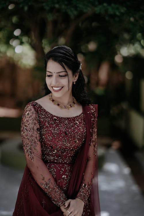 Portrait of Smiling Woman in Red Dress