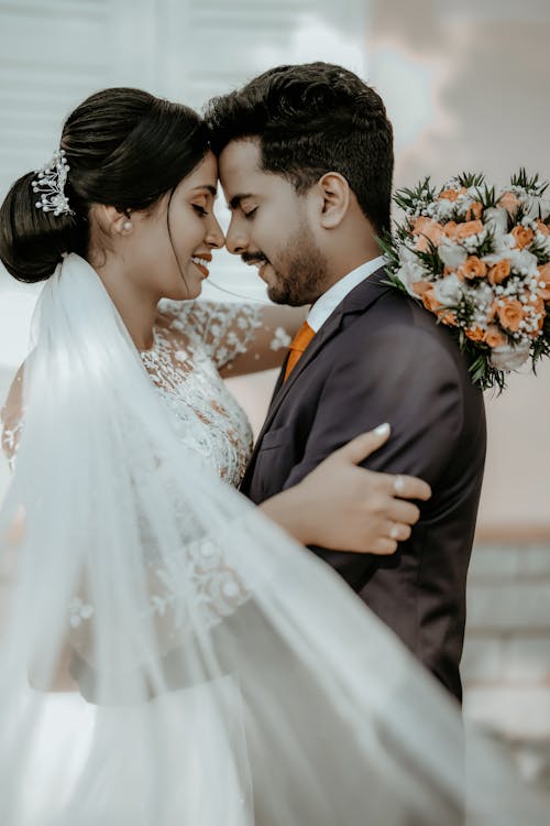 Newlyweds Standing Together and Hugging