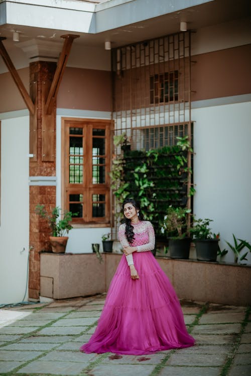 Smiling Woman in Pink Dress