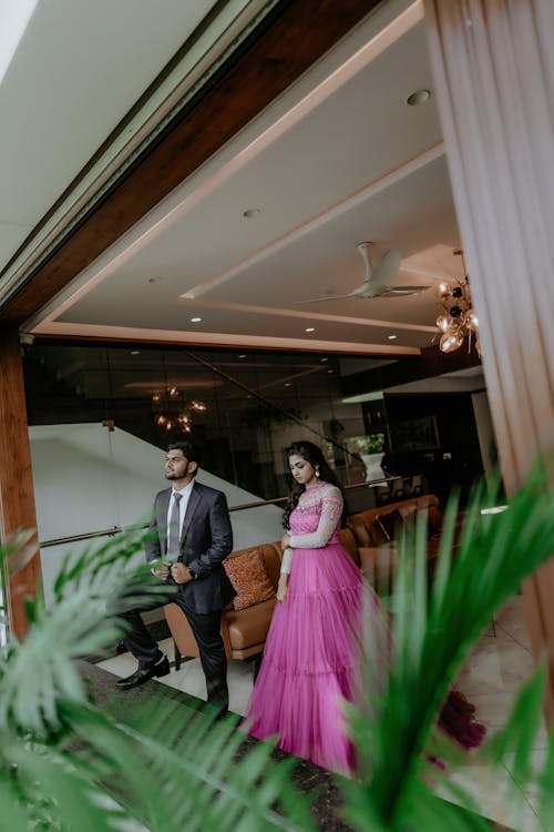 Woman in Pink Dress and Man in Suit