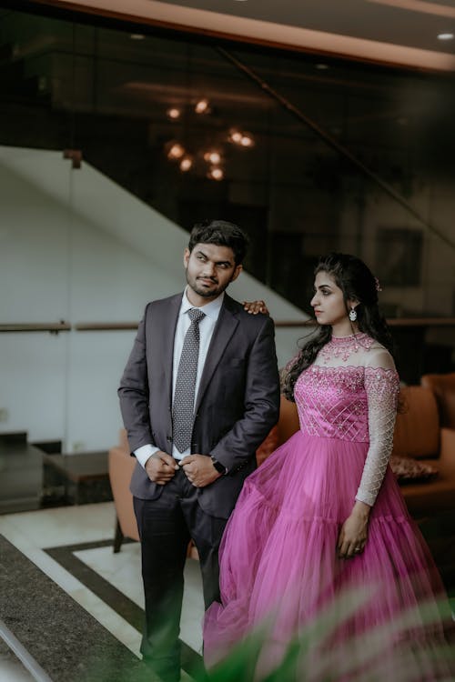 Man in Suit and Woman in Pink Dress