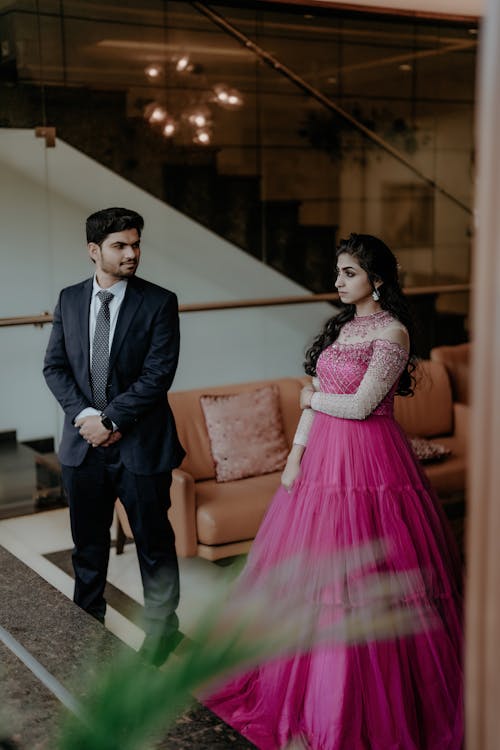 Man in Suit and Woman in Pink Dress