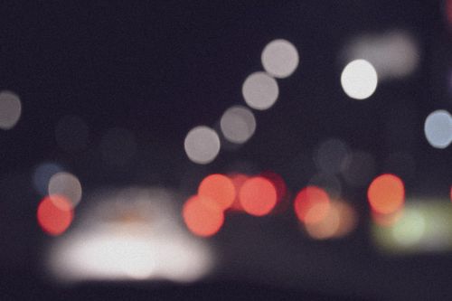 Free Abstract view of blurred traffic lights at night in Bogotá, Colombia. Stock Photo