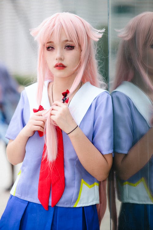 Girl in a Uniform Leaning on a Window 