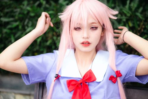 Free Close-up of a girl in anime cosplay attire with pink hair and a colorful outfit. Stock Photo