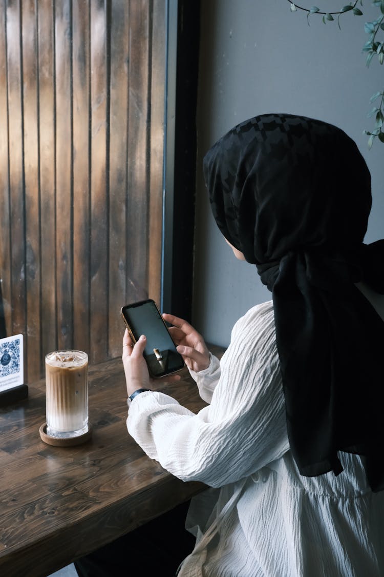 Sitting Woman Using A Smart Phone