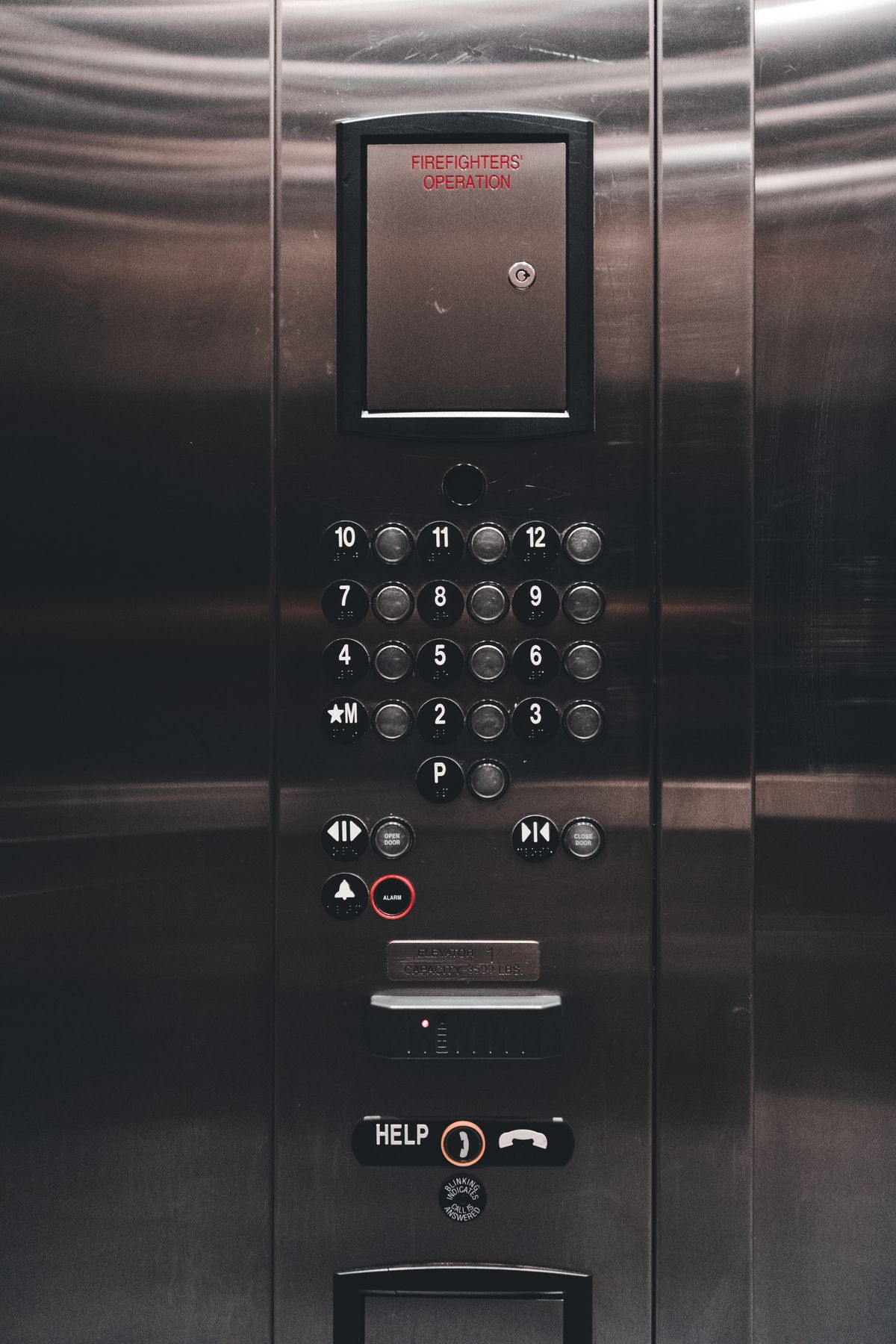 Modern elevator car operating panel buttons display and stainless steel faceplate