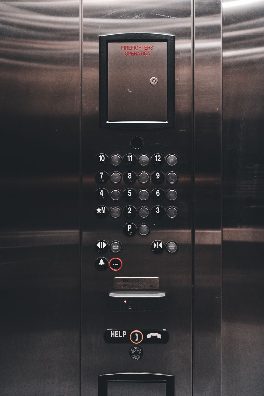 Car operating panel inside modern elevator cabin