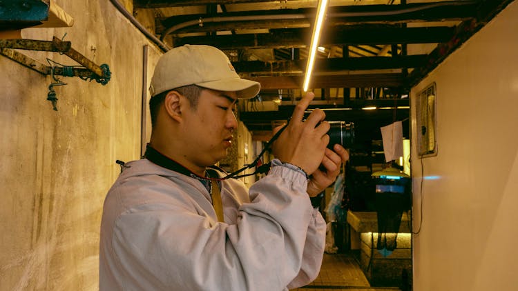 Man Standing With Camera