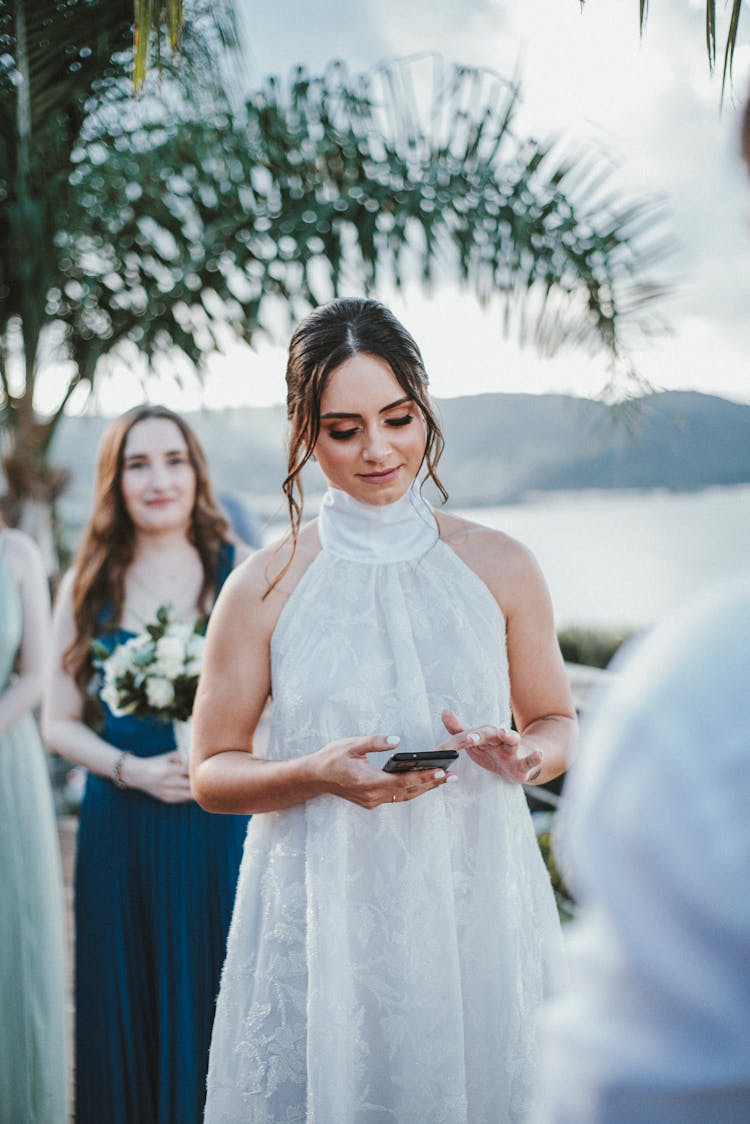 Bride Standing Among Wedding Guests 