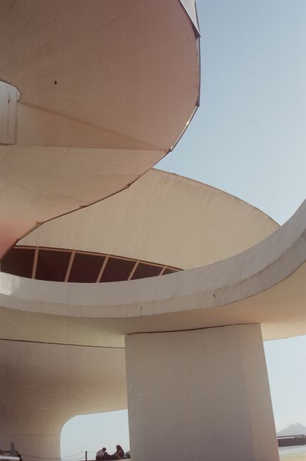 Close-up of the iconic Niterói Contemporary Art Museum in Brazil showcasing its futuristic design against a clear sky.