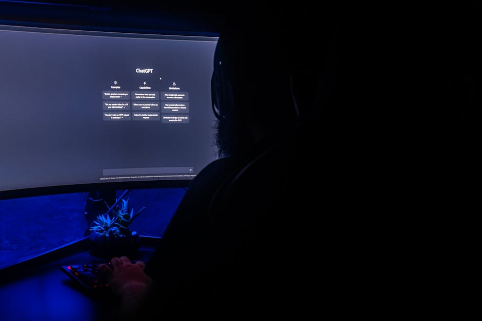 CyberGhost vs Private Internet Access: Torrenting Safety and Speed Faceoff Silhouette of a person using ChatGPT on a computer screen in a dark room, highlighting digital interaction.