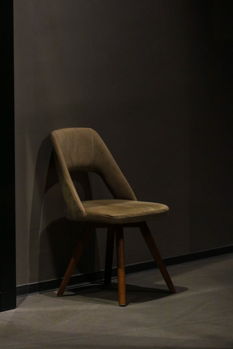 A Modern Chair In An Empty Room 