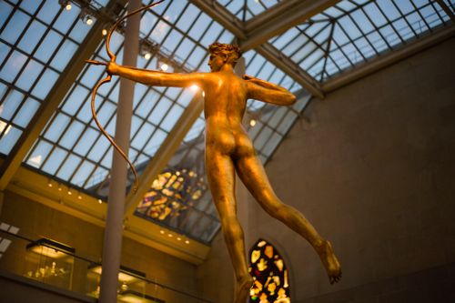 Free A stunning golden statue of an archer at the Metropolitan Museum of Art, capturing classical elegance. Stock Photo