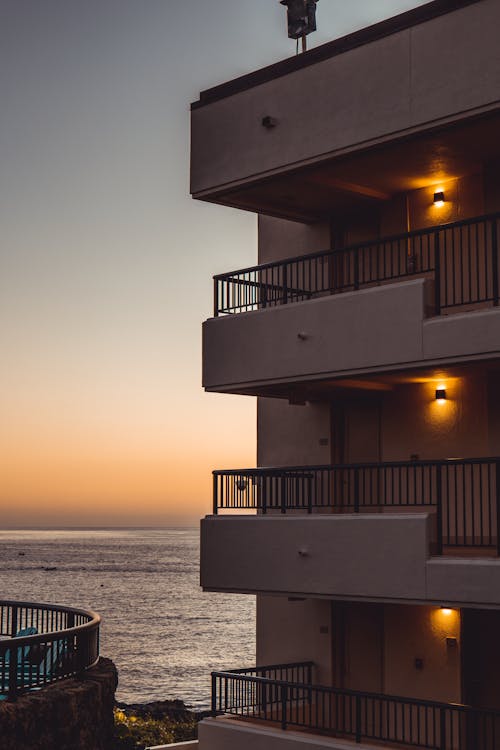 View of Apartment Block with Balconies with View of the Sea at Sunset