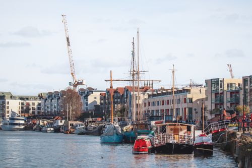 Free Explore the bustling Bristol harbor with moored boats and urban architecture on a sunny day. Stock Photo