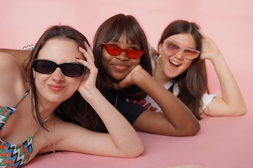 Smiling Models Posing in Sunglasses