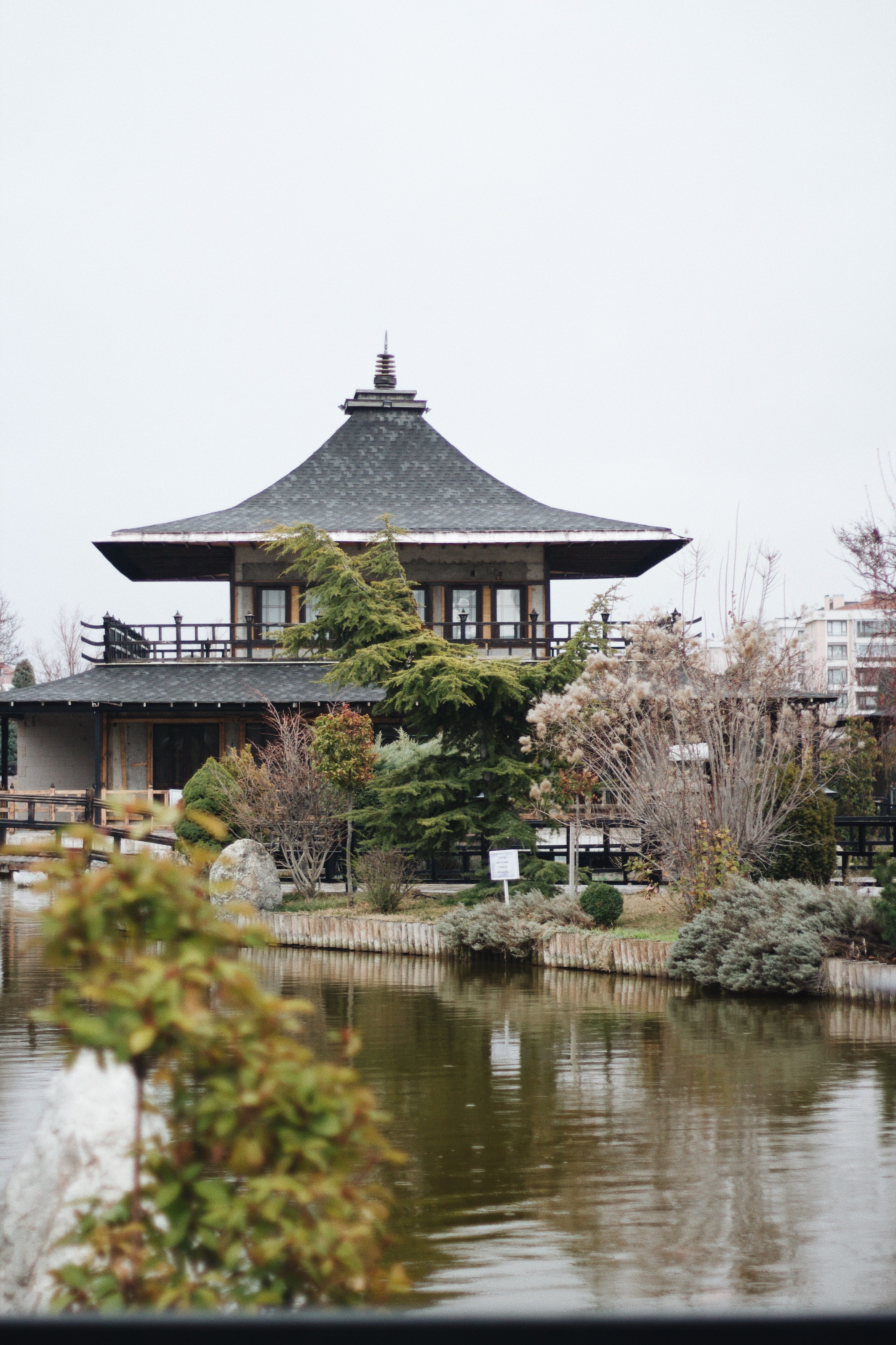 Red and Black Temple Surrounded by Trees Photo · Free Stock Photo