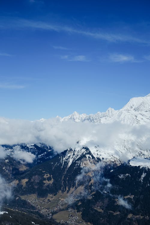 Free Clouds and Blue Sky in Mountains Stock Photo