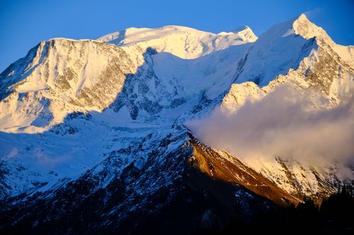 Free Stunning view of Mont Blanc with snowcapped peaks in golden sunset light, Chamonix, France. Stock Photo