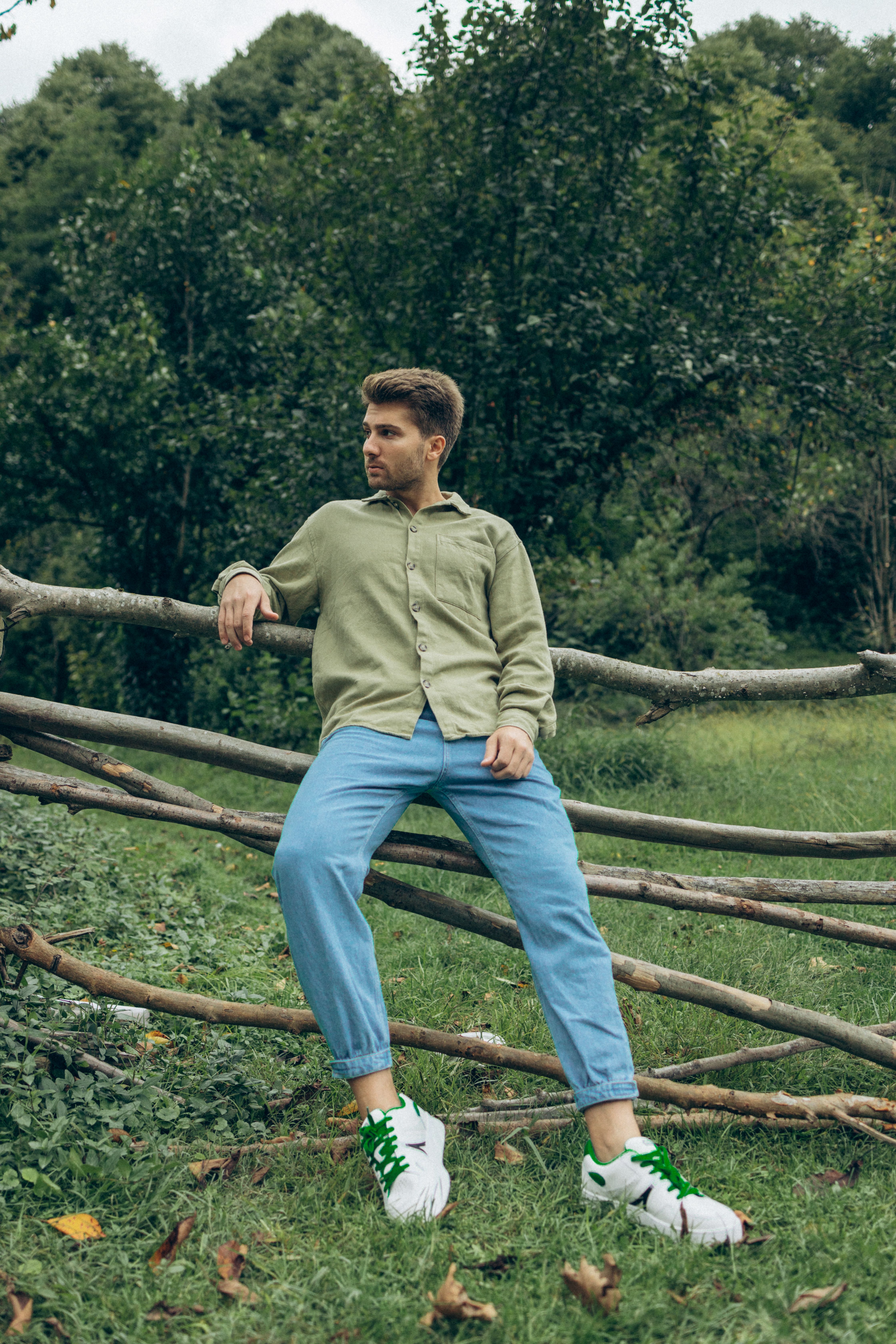 Young Man Standing on a Rural Field · Free Stock Photo