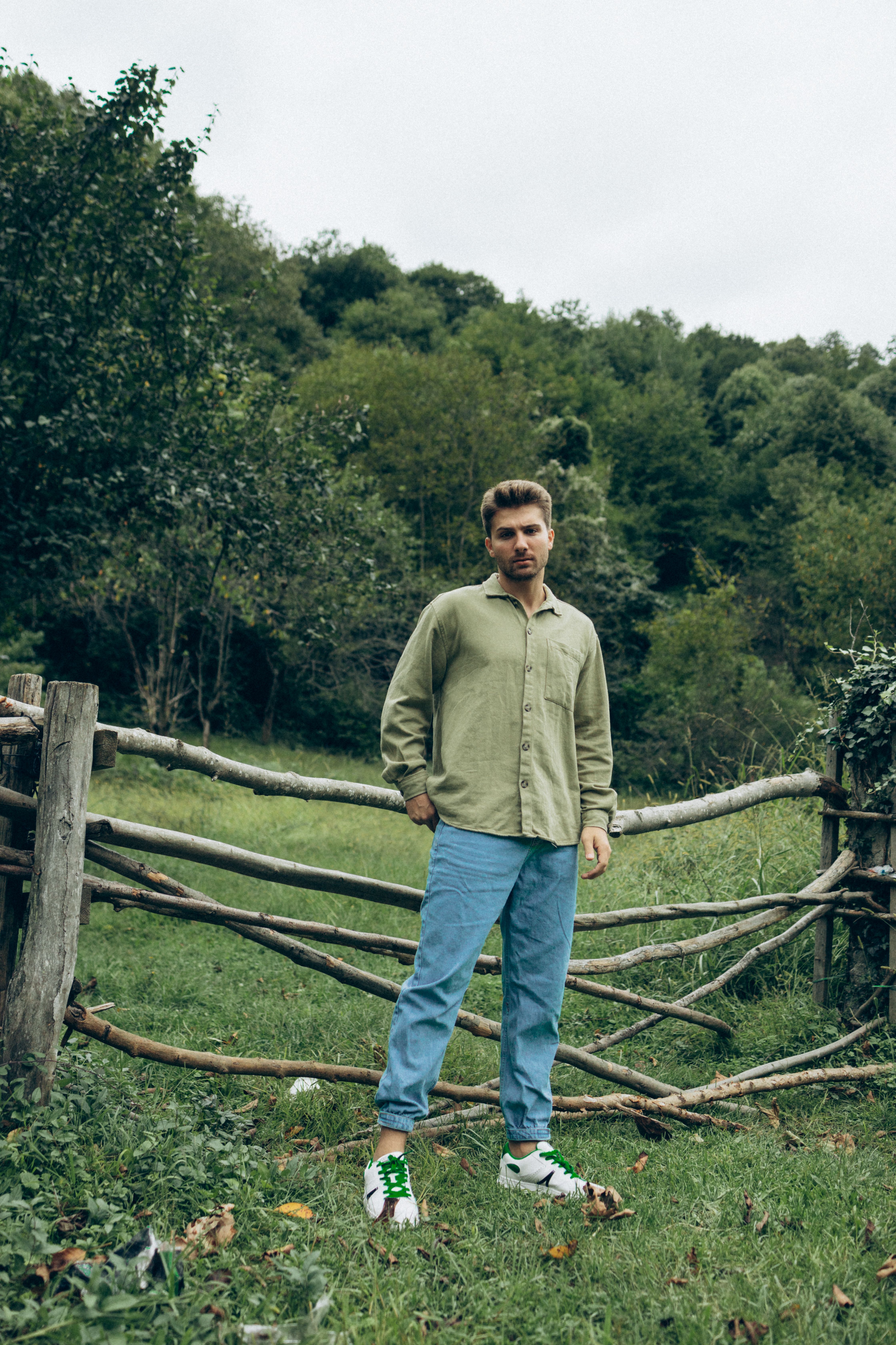 Young Man Standing on a Rural Field · Free Stock Photo