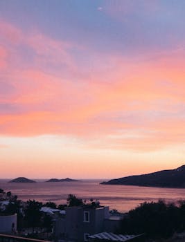 Delightful view of the ocean at sunset with islands and colorful sky. Perfect travel and nature scene.