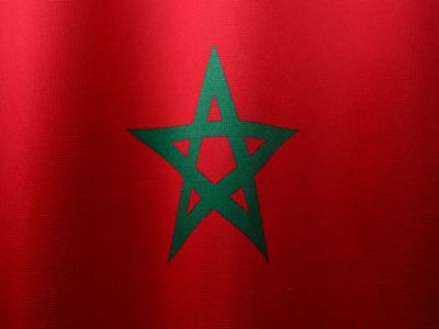 Close-up of the Moroccan flag with vibrant colors and green star