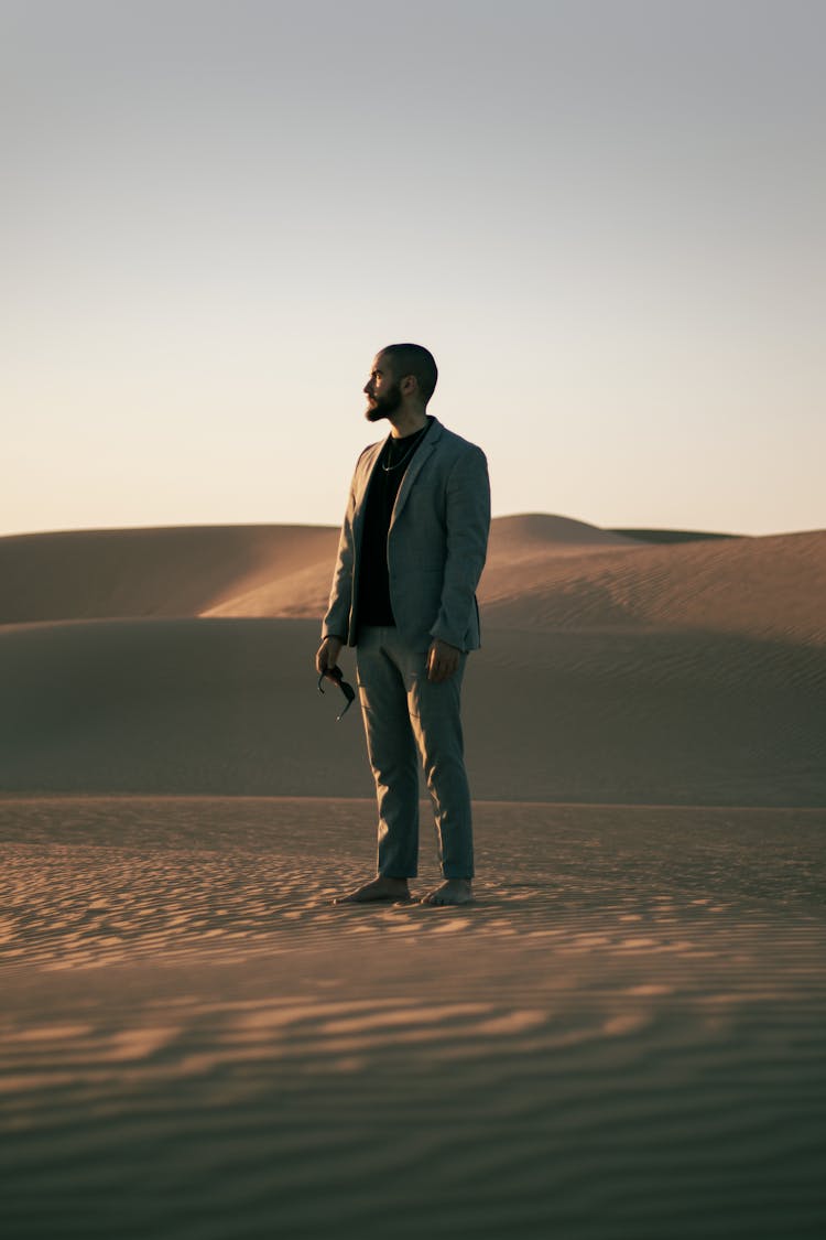 Model In Tshirt And Suit In Desert