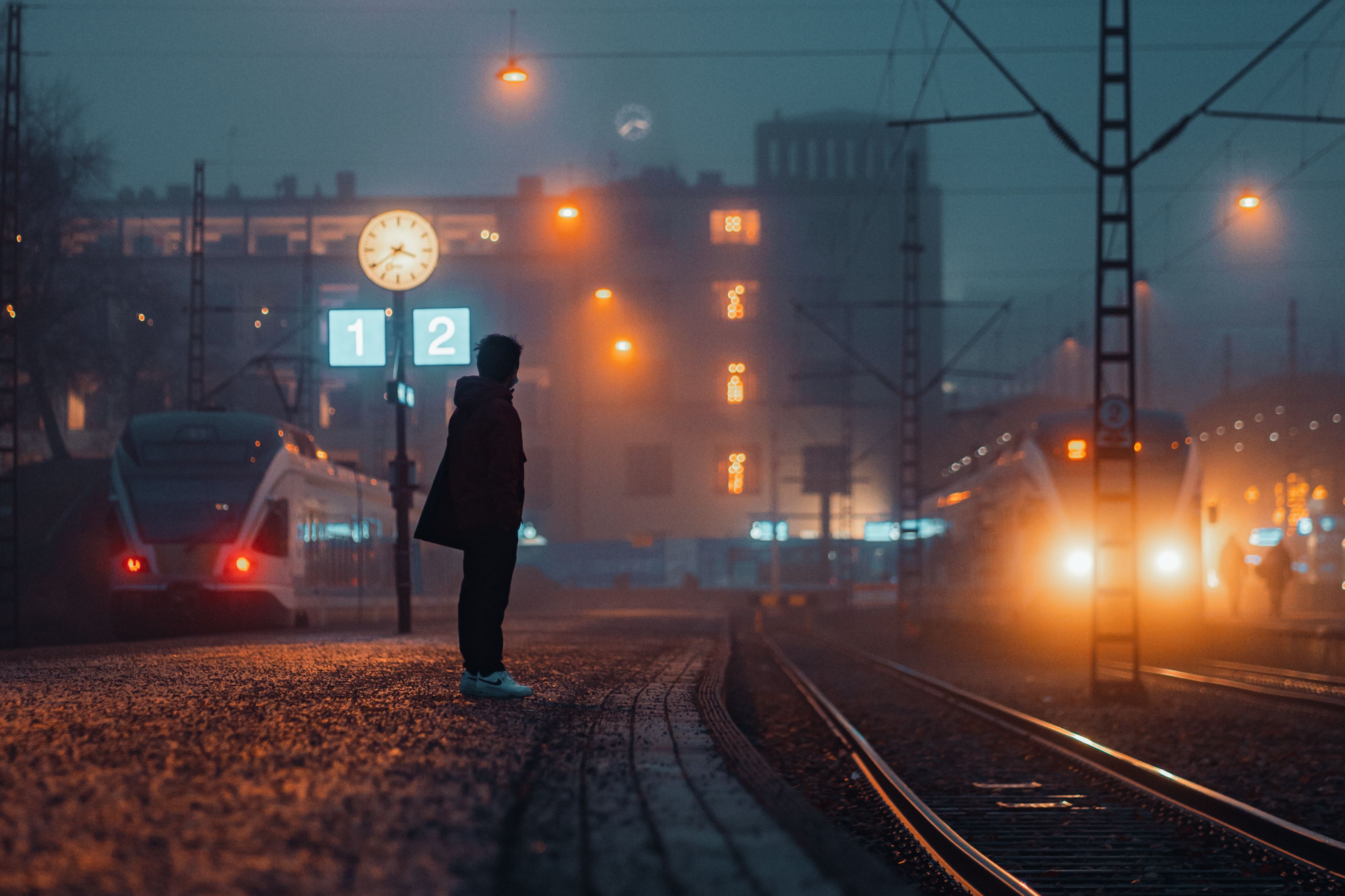 Red tram moving through a city street in Helsinki, Finland