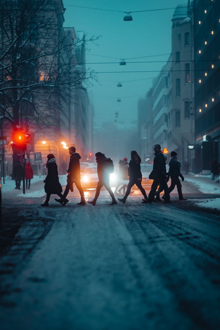 People Walking On City Street On Winter Day