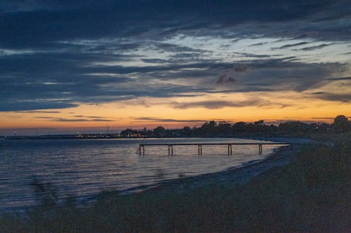 Бесплатное стоковое фото с береговая линия, живописный, закат