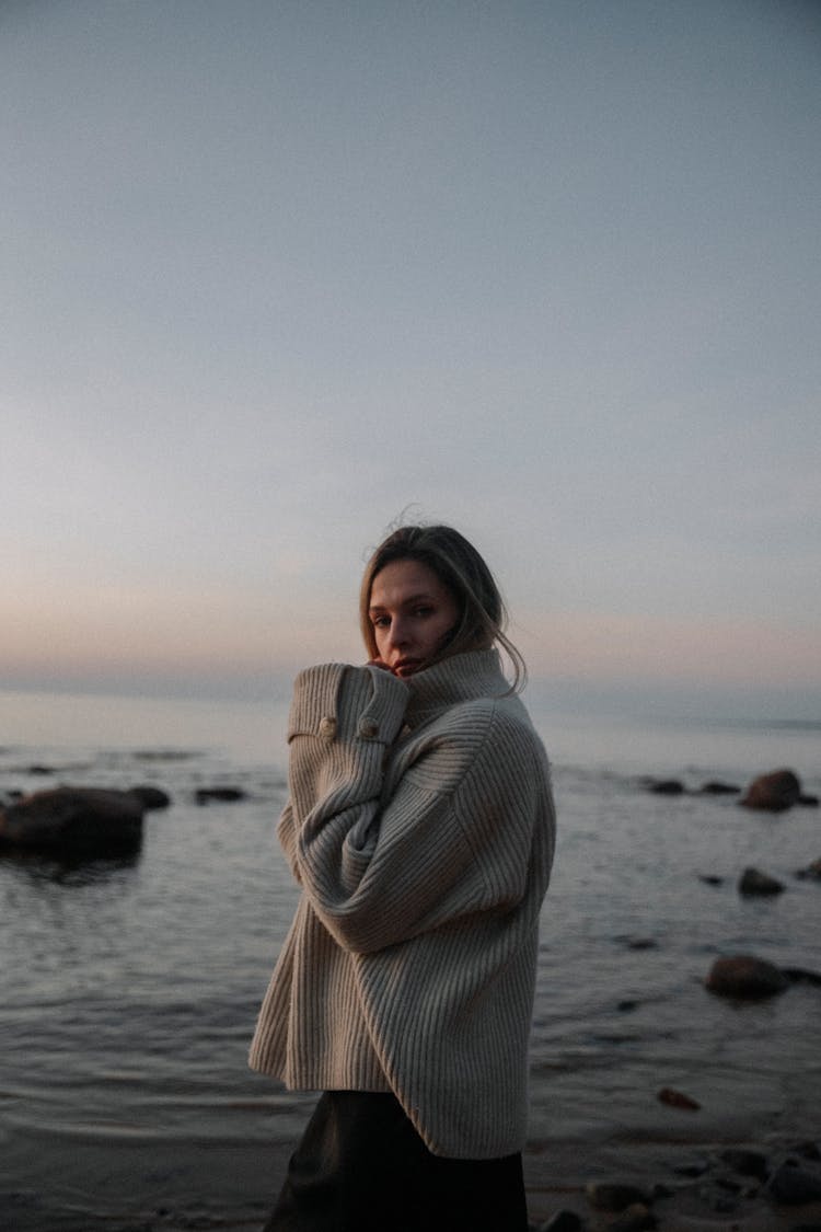 Woman Wearing Jumper On Beach