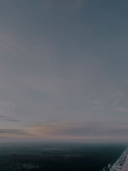 Free Aerial view of the Kalngale coastline at twilight with expansive sky and dark horizon. Stock Photo