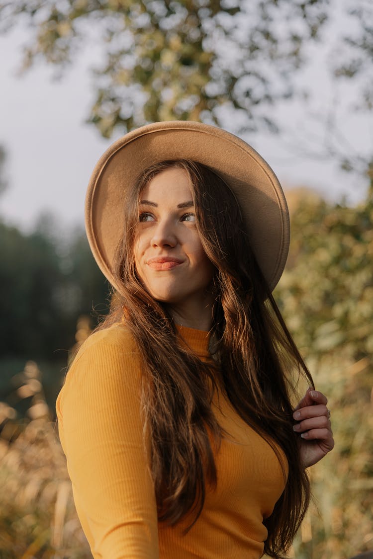 Pretty Woman With Hat Looking Up