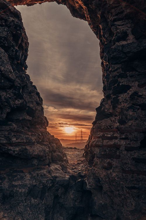 Sun Rays Behind Rocks Sunlight under Clouds behind Rocks · Free Stock Photo